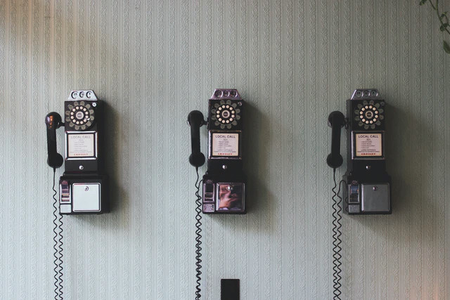 Ladnline phones on a wall
